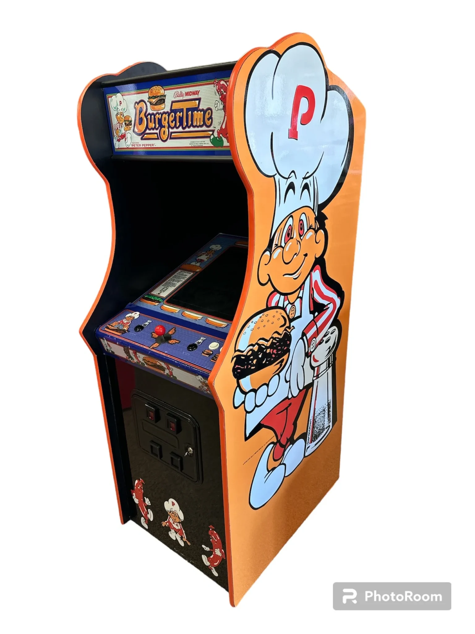 A video game cabinet with an image of a chef on the side.